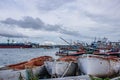 Chon buri,THAILAND-JULY 9,2020 : Fishing boat and fisherma in Thailand at Laemchabang Port in Thailand. Wooden boats. Old boat Royalty Free Stock Photo