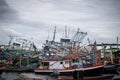 Chon buri,THAILAND-JULY 9,2020 : Fishing boat and fisherma in Thailand at Laemchabang Port in Thailand. Wooden boats. Old boat Royalty Free Stock Photo