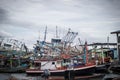 Chon buri,THAILAND-JULY 9,2020 : Fishing boat and fisherma in Thailand at Laemchabang Port in Thailand. Wooden boats. Old boat Royalty Free Stock Photo