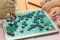 Student playing scrabble cross word