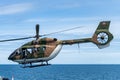 The Eurocopter EC 645 T2 helicopter of royal Thai navy fly over the sea near Sattahip naval base, Chonburi, Thailand