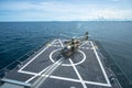 Eurocopter EC 645 T2 helicopter is tied down on the flight deck of HTMS. Bhumibol Adulyadej