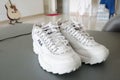 White sports shoes, Fila brand, are good for health. for jogging