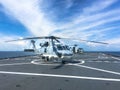Wo Sikorsky S-70B Sea Hawk helicopter of Royal Thai Navy parks on the helicopter deck of HTMS Angthong