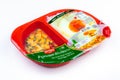 CHONBURI, THAILAND-MAY 15, 2020 : Stir-fried basil chicken+ fried egg with rice in plastic box food package. Microwave food for to