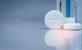 NAC long effervescent tablets and tube drug container on gradient background. Round white tablet pill. Pharmaceutical product. Muc