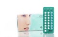 Oilezz. 22 hormones blue and white tablets in blister pack on blurred background of birth control pills box. Oral contraceptive pi