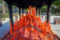 CHONGYUANG TEMPLE, CHINA - 29 JANUARY, 2017: Wooden table structure with many red candle lights, part of temple complex