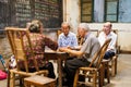 Senior chinese people playing mahjong in an ancient tearoom