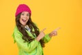 Choose between cutest and trendiest. Girl long hair yellow background. Cold season concept. Winter fashion accessory
