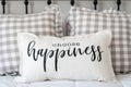 Choose happiness pillow on the bed