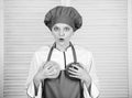 Choose only healthy. cook in restaurant, uniform. girl in apron and hat hold bowls. professional chef cooking in kitchen