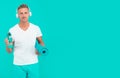 Choose sport drink wisely. Athletic man hold sport bottle and gym mat. Handsome sportsman blue background. Hydration for Royalty Free Stock Photo