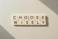 Choose Wisely Letters on a Neutral Background in Soft Natural Light Royalty Free Stock Photo