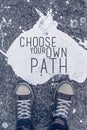 Choose your own path motivational quote on urban asphalt background