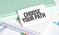 CHOOSE YOUR PATH on card and charts Royalty Free Stock Photo