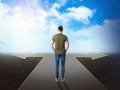 Choose your way. Man standing at crossroads taking important decision Royalty Free Stock Photo