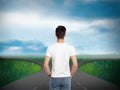 Choose your way. Man standing at crossroads taking important decision Royalty Free Stock Photo