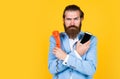 Choose your World. Then and Now. mature bearded man talk on retro phone. male hold smartphone. compare technology Royalty Free Stock Photo