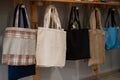 Choosing cotton bags in an eco-friendly store. Royalty Free Stock Photo