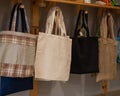 Choosing cotton bags in an eco-friendly store. Royalty Free Stock Photo
