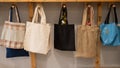 Choosing cotton bags in an eco-friendly store. Royalty Free Stock Photo