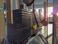 Choosing different weight options for weight lifting in a gym during an everyday workout training for increasing muscle mass