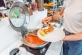 Choosing food in open buffet at breakfast in hotel Royalty Free Stock Photo