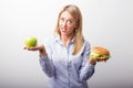 Choosing between healthy and unhealthy foods Royalty Free Stock Photo