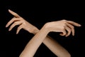 Male and female hands demonstrating a gesture of getting touch isolated on gray background