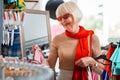 Stylish elderly woman in a clothing shop