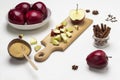 Chopped apples on cutting board. Brown sugar in coconut shell Royalty Free Stock Photo