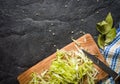 Chopped cabbage on a black stone background.