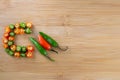 Chopped chili pepper red and green on wooden surface Royalty Free Stock Photo