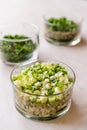 Chopped Chives, Parsley and Dill in Glass Bowls