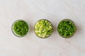 Chopped Chives, Parsley and Dill in Glass Bowls