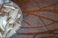 Chopped coconut in a bowl on a wooden table