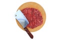 Chopped fine beef with cleaver knife on circle wood chopping board isolated on white background. Raw minced meat on wooden block Royalty Free Stock Photo