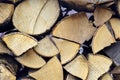 Chopped firewood is stacked in neat piles. Woodpile. Background. Close-up. Royalty Free Stock Photo