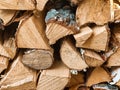 Chopped firewood is stacked in neat piles. Woodpile. Background. Close-up. Royalty Free Stock Photo