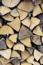 Chopped firewood is stacked in neat piles. Woodpile. Full frame, background. Close-up. Royalty Free Stock Photo