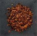 Chopped fragrant dried paprika, spices for cooking, macro photography Royalty Free Stock Photo