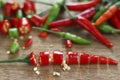 Chopped fresh red and green chilli on wooden chopping block