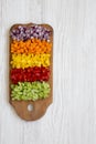 Chopped fresh vegetables arranged on cutting board on white wooden table, overhead view. Flat lay, from above, top view. Copy spac Royalty Free Stock Photo