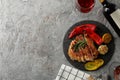 Chopped fried pork steak, vegetables and wine on background. Grilled food Royalty Free Stock Photo