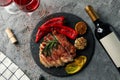 Chopped fried pork steak vegetables and wine on gray background. Grilled food Royalty Free Stock Photo