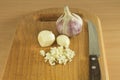 Chopped garlic on a wooden cutting board Royalty Free Stock Photo