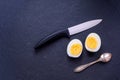 Chopped hard-boiled egg on stilish natural black shell board Royalty Free Stock Photo