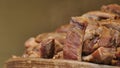 chopped homemade barbecued pork ribs in a wooden pot. Sliced roasted meat