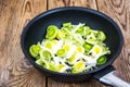 Chopped leeks in frying pan Royalty Free Stock Photo
